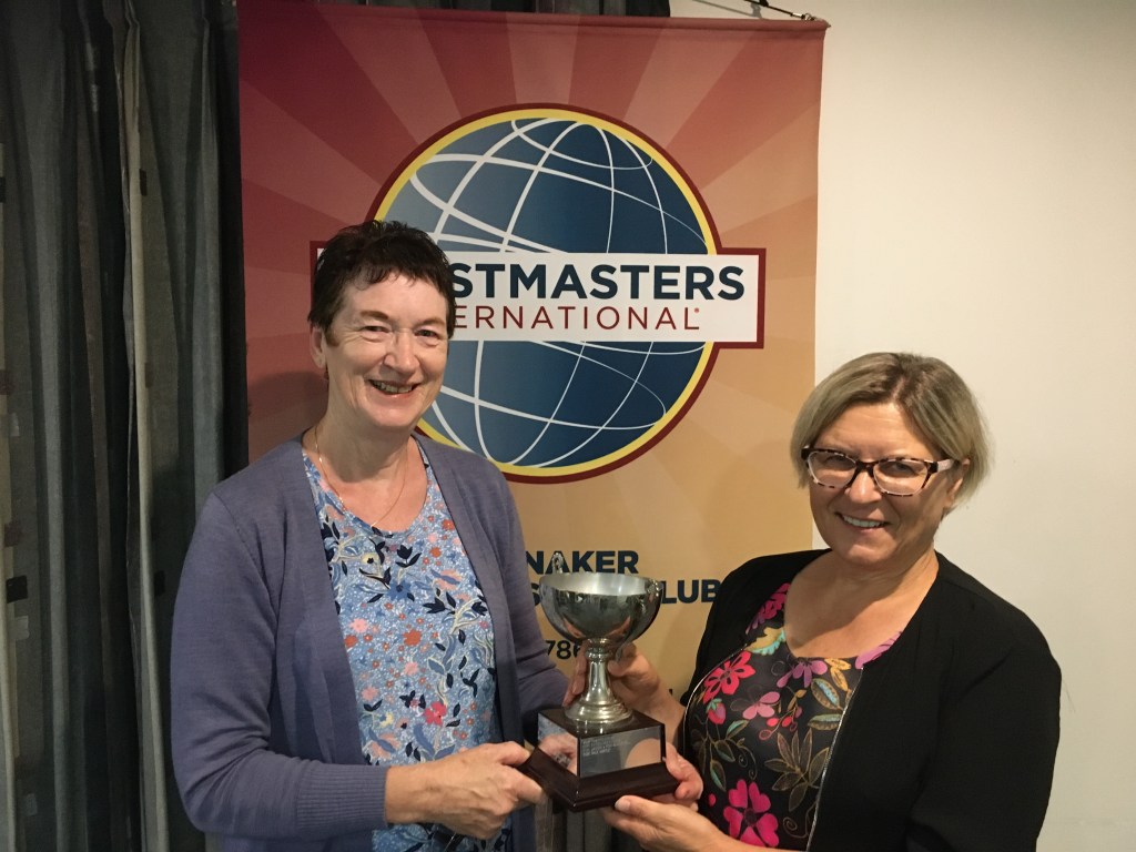 Dale at left receiving the Knight Motivation Trophy from President Katina.